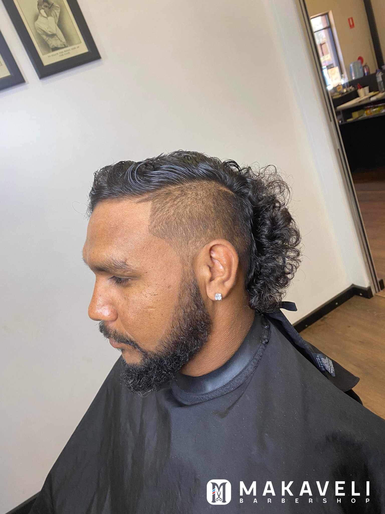 Curly mullet with a skin fade